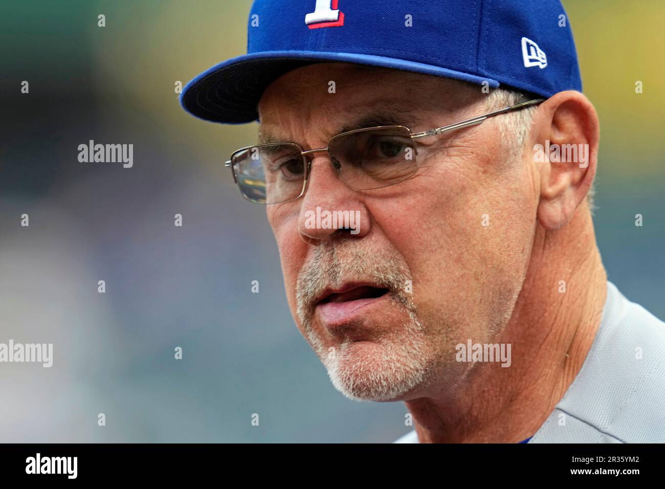 Texas Rangers manager Bruce Bochy delivers the lineup to the umpires ...