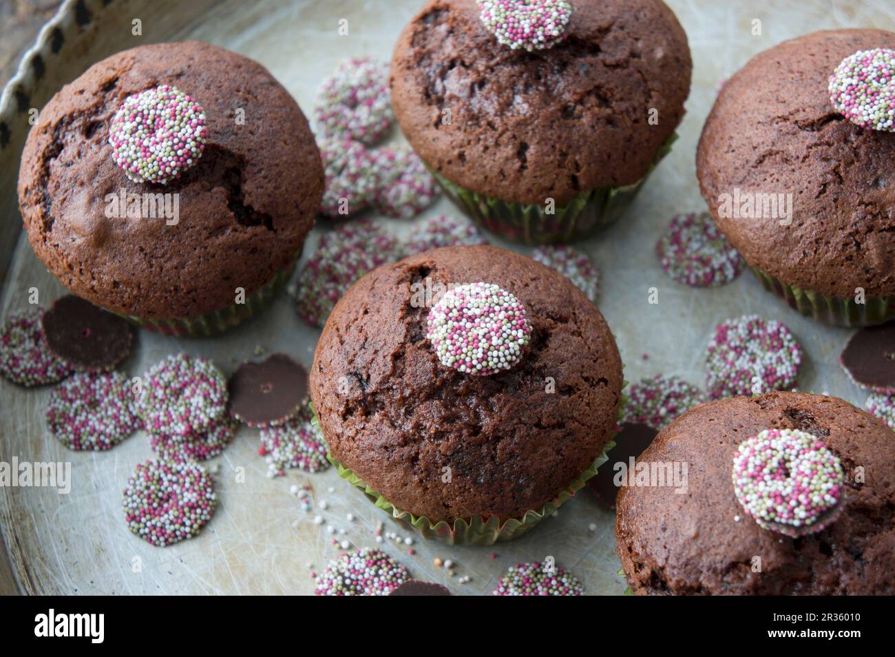 Chocolate and cherry muffins decorated with chocolate jazzies Stock Photo