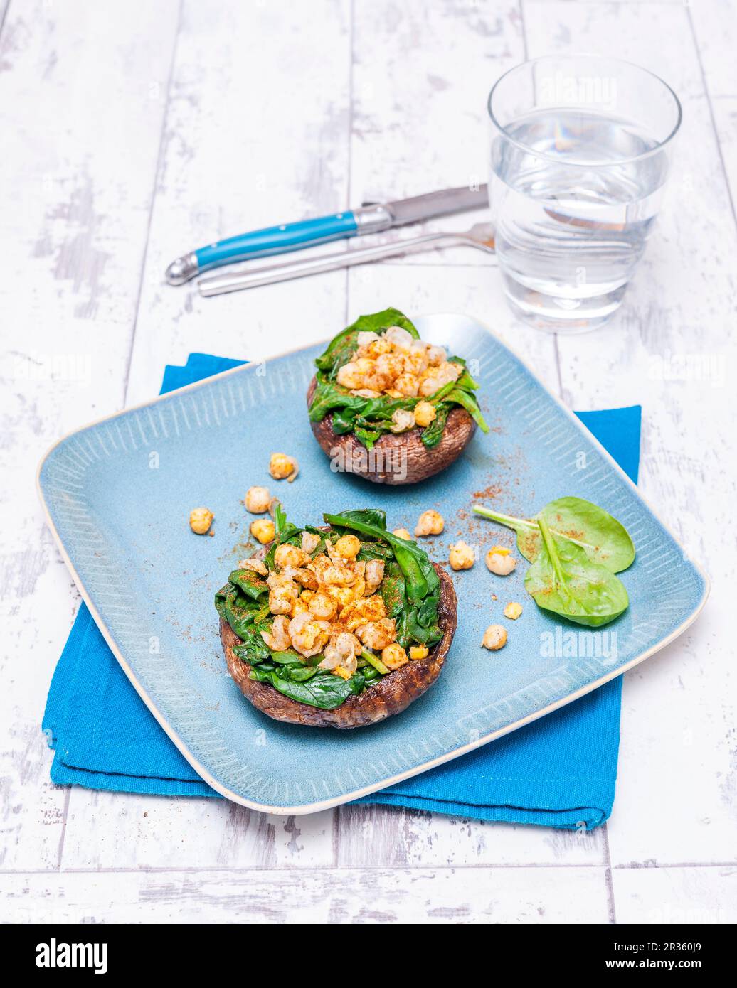 Portobello mushrooms filled with spinach and chickpeas Stock Photo