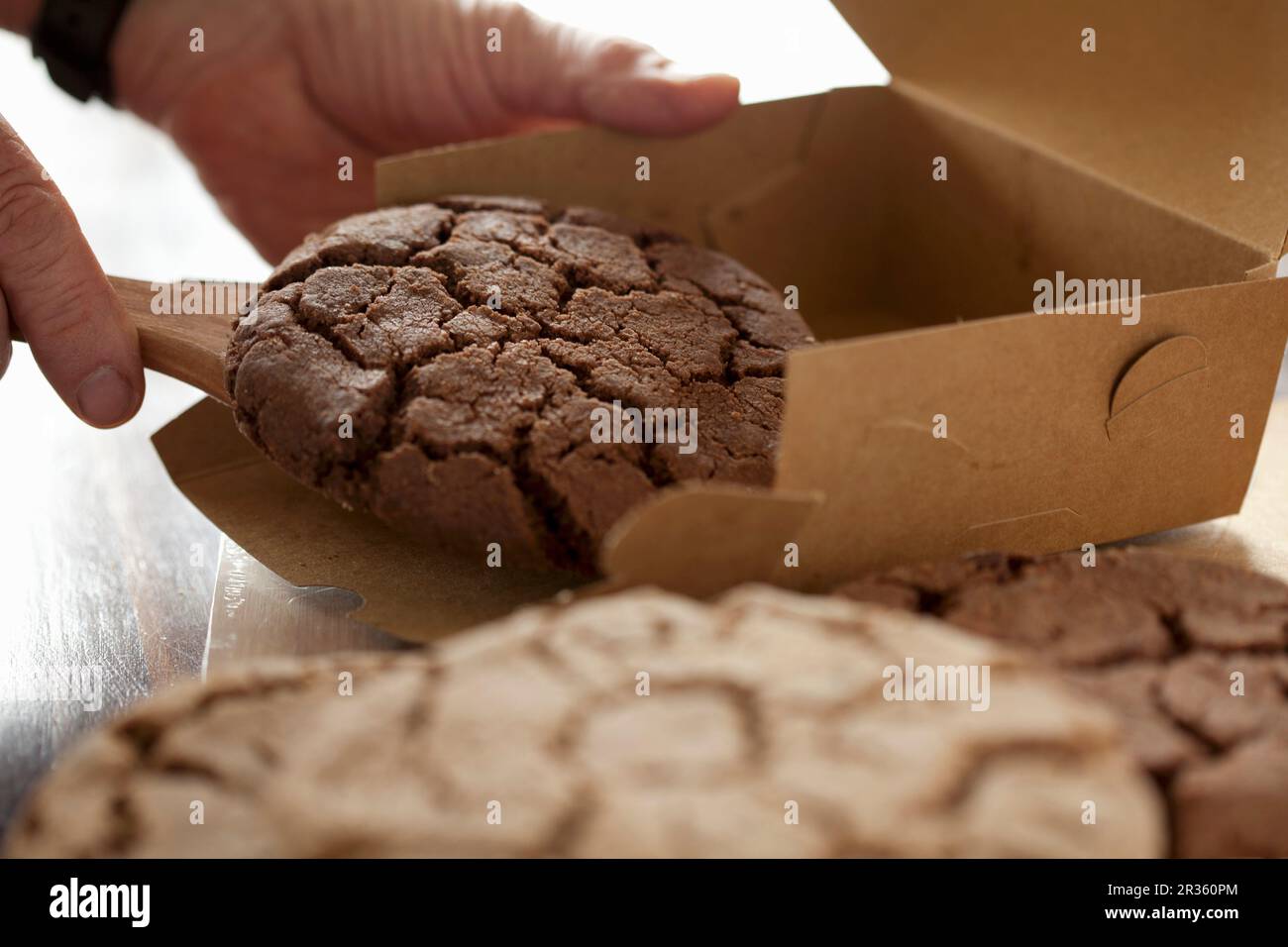 Packaging chocolate chip cookies hand hi-res stock photography and ...