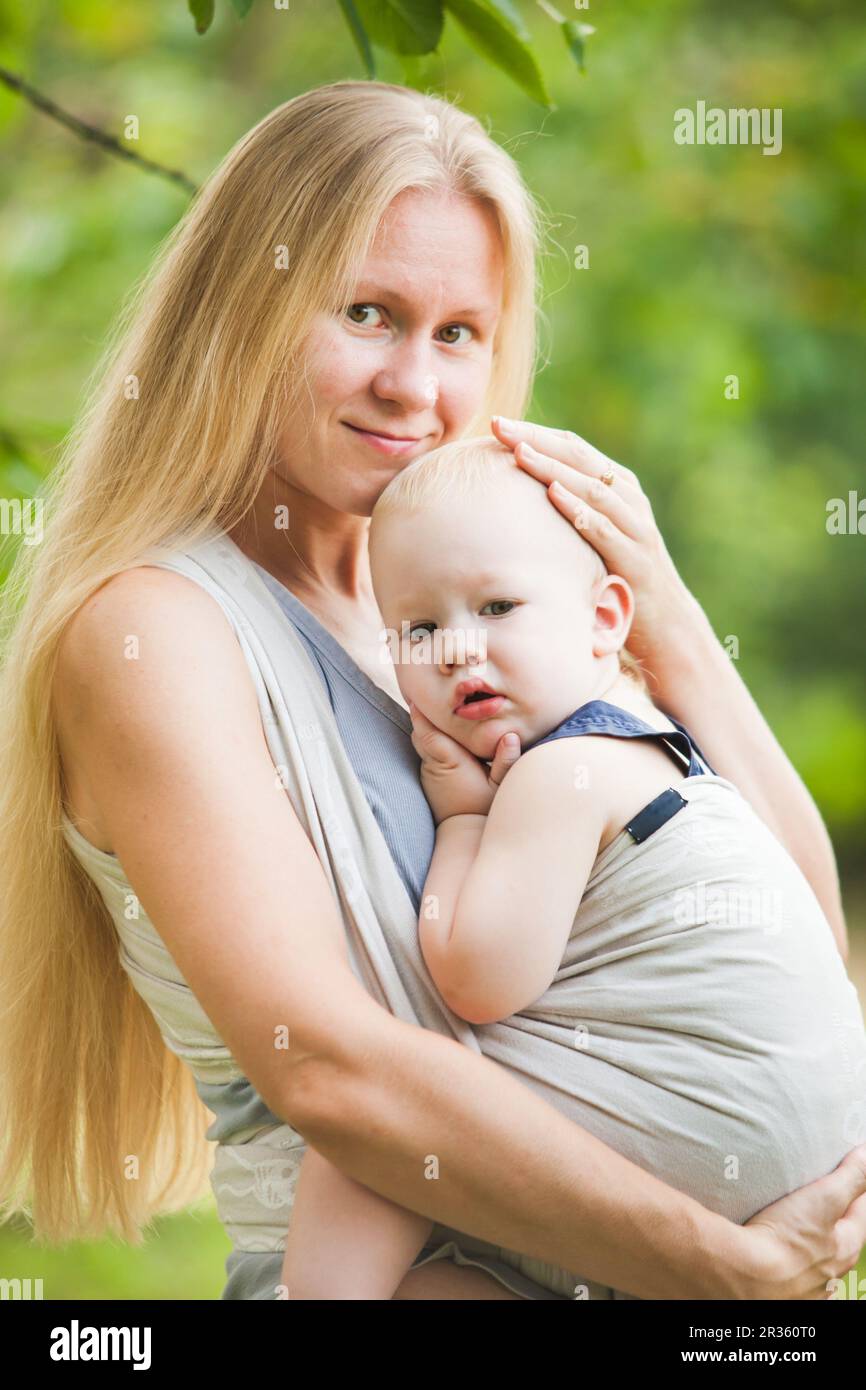 Baby in sling Stock Photo