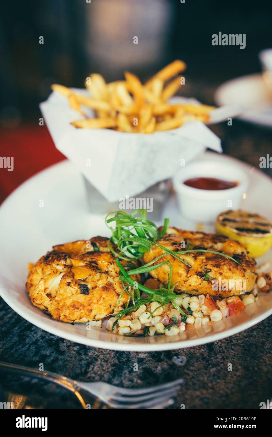 Crab cakes with chips and dip Stock Photo Alamy
