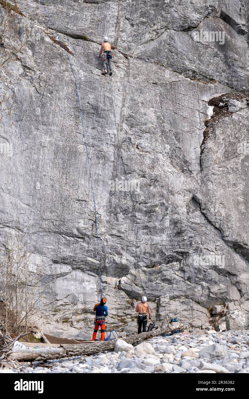 Three Unrecognizable Men Rock Climbing in Banff National Park Stock Photo