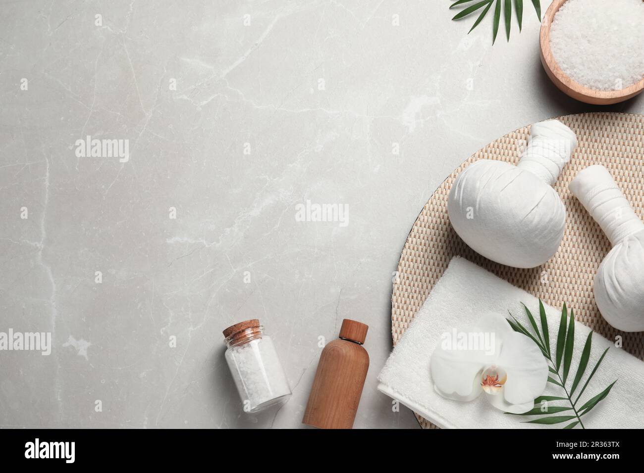 Flat lay composition with herbal massage bags and other spa products on ...