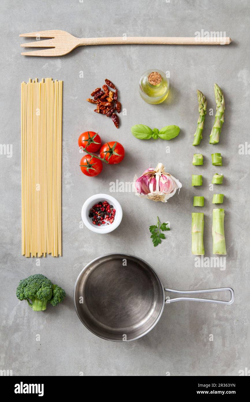 An arrangement of kitchen utensils and ingredients for pasta dishes Stock Photo