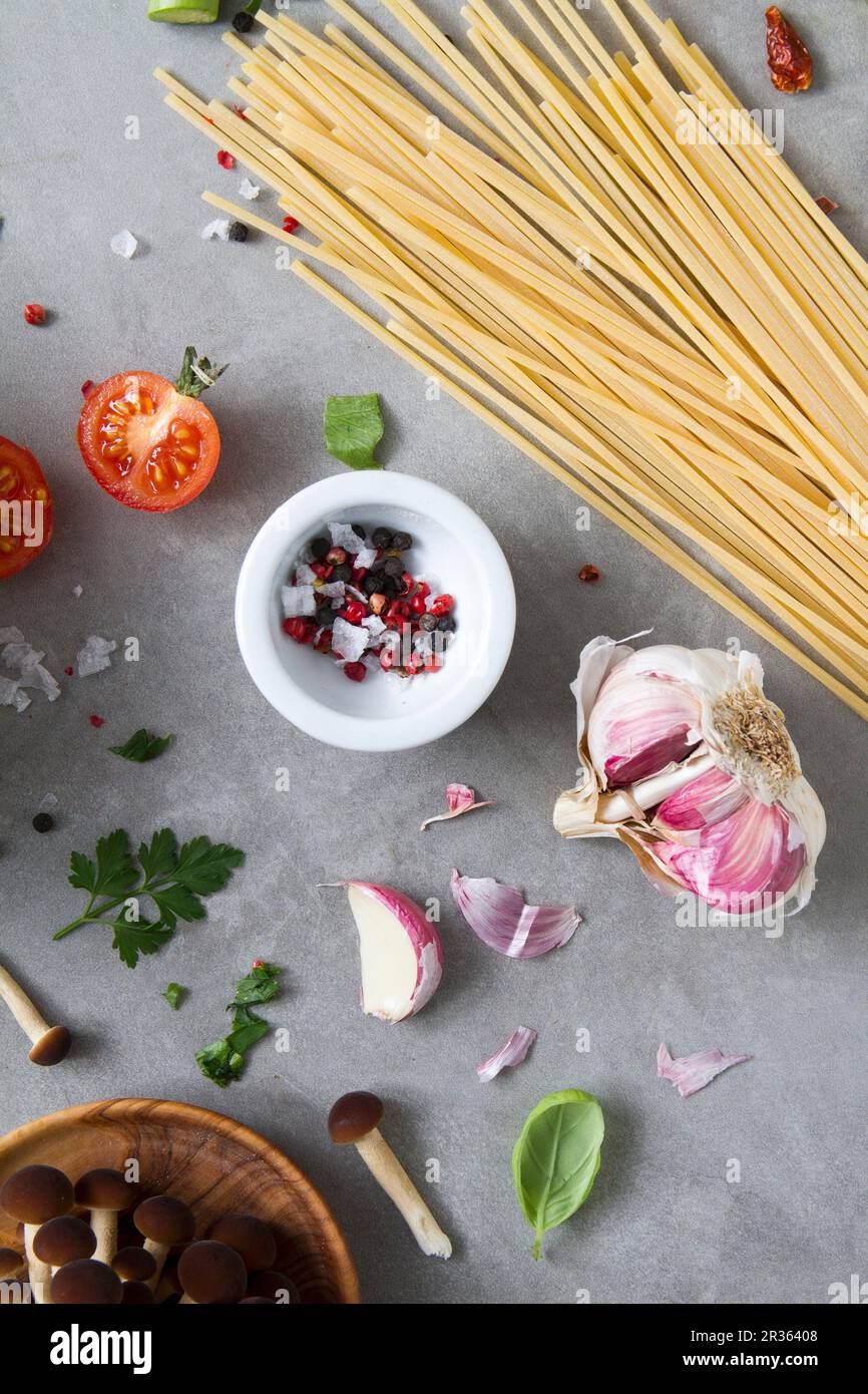 An arrangement of ingredients for pasta dishes with vegetables Stock Photo