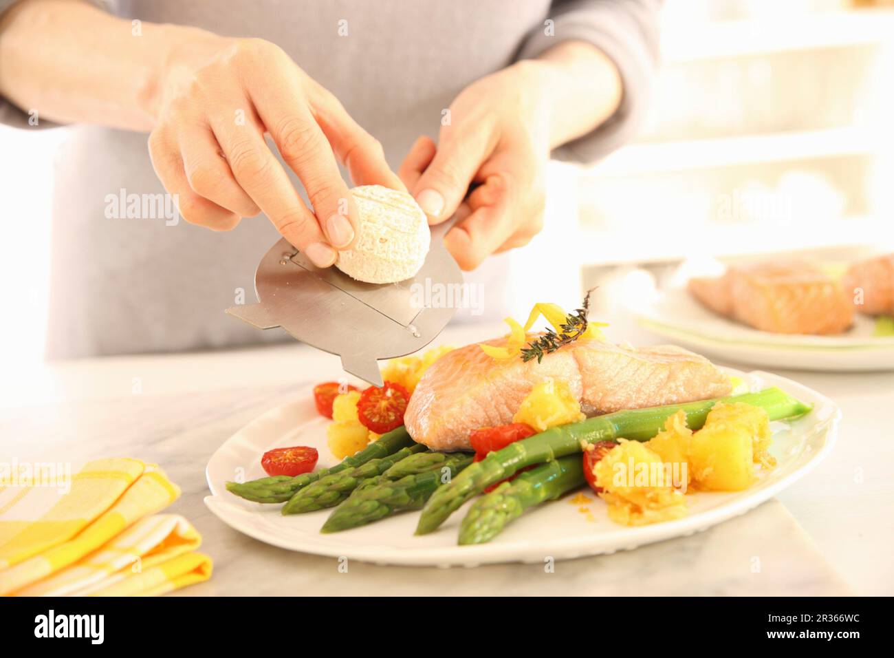 https://c8.alamy.com/comp/2R366WC/salmon-fillet-confit-with-green-asparagus-crispy-diced-potatoes-and-goats-cheese-2R366WC.jpg