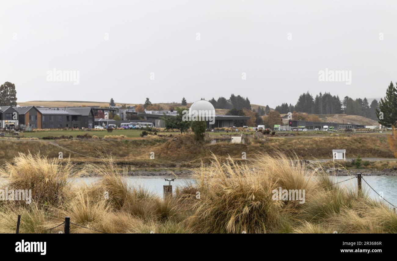 Tekapo, New Zealand - April 21, 2023: Landscape view of the shops and Dark Sky Project Observatory as viewed from the Church of the Good Shepherd. Stock Photo