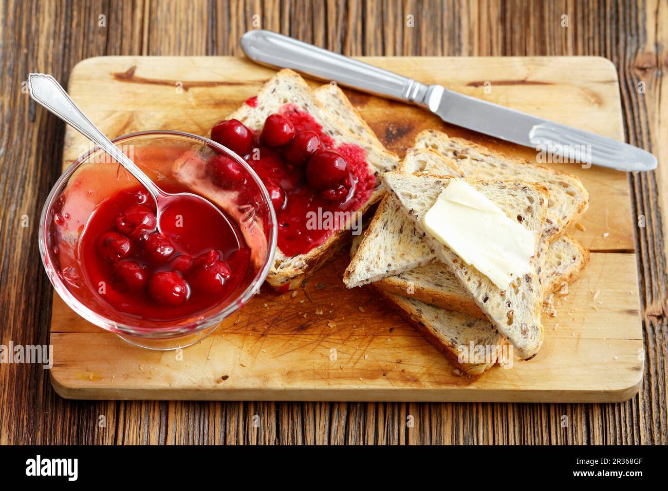 Toast with cherry jam and butter Stock Photo