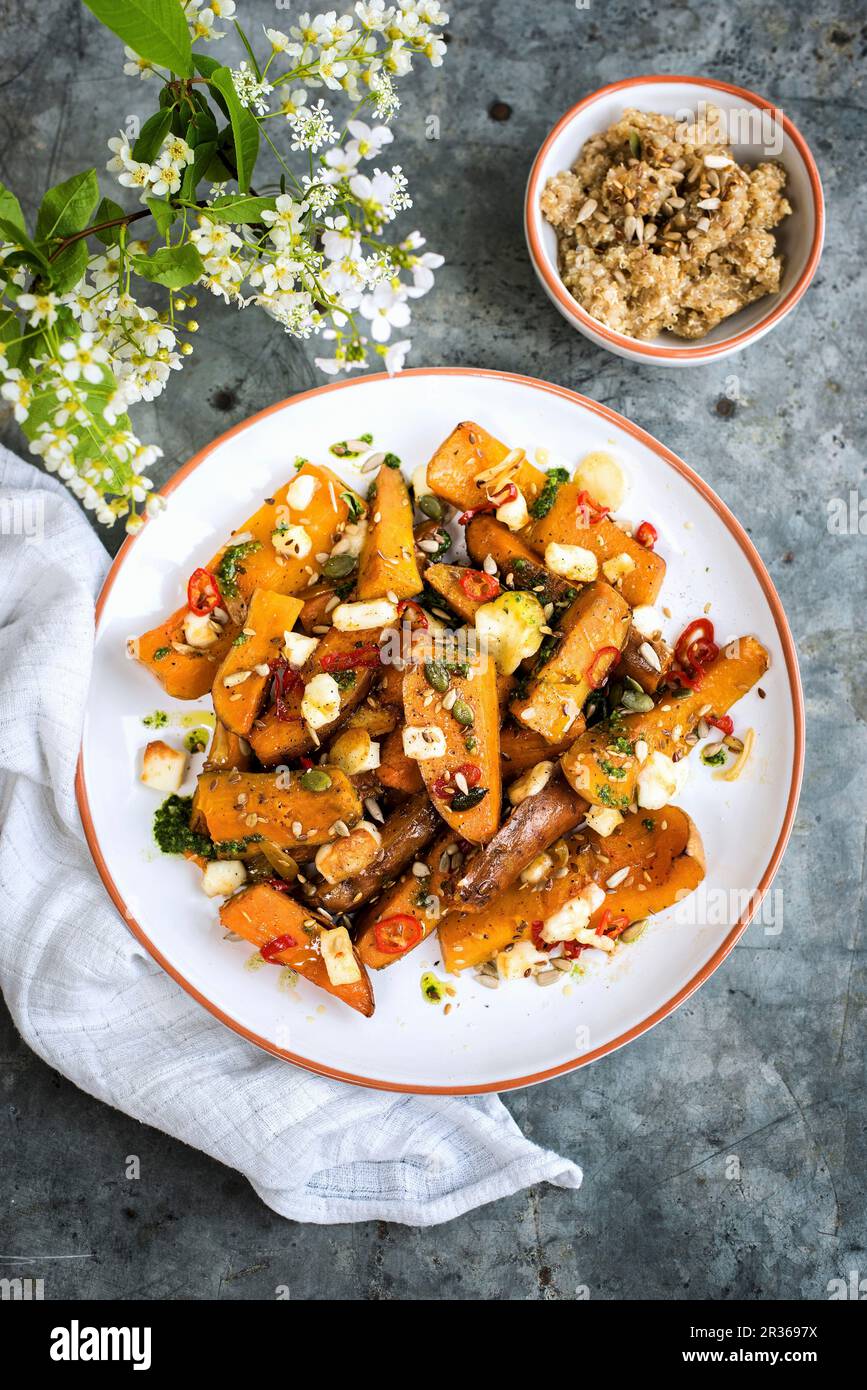 Honeygalzed sweet potatoes and squash with chilli and halloumi Stock