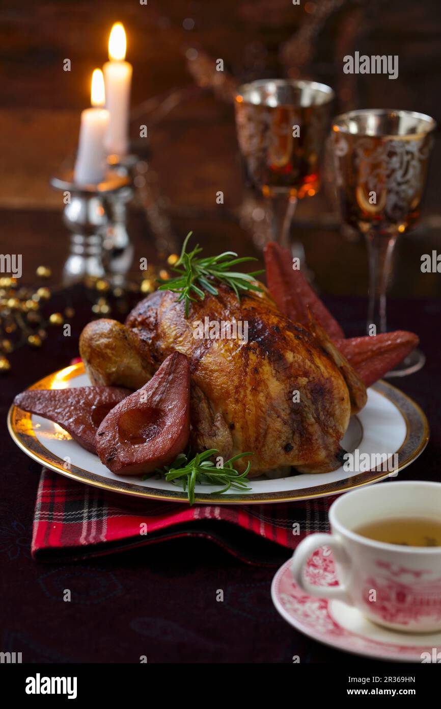 Capon with red wine pears Stock Photo Alamy