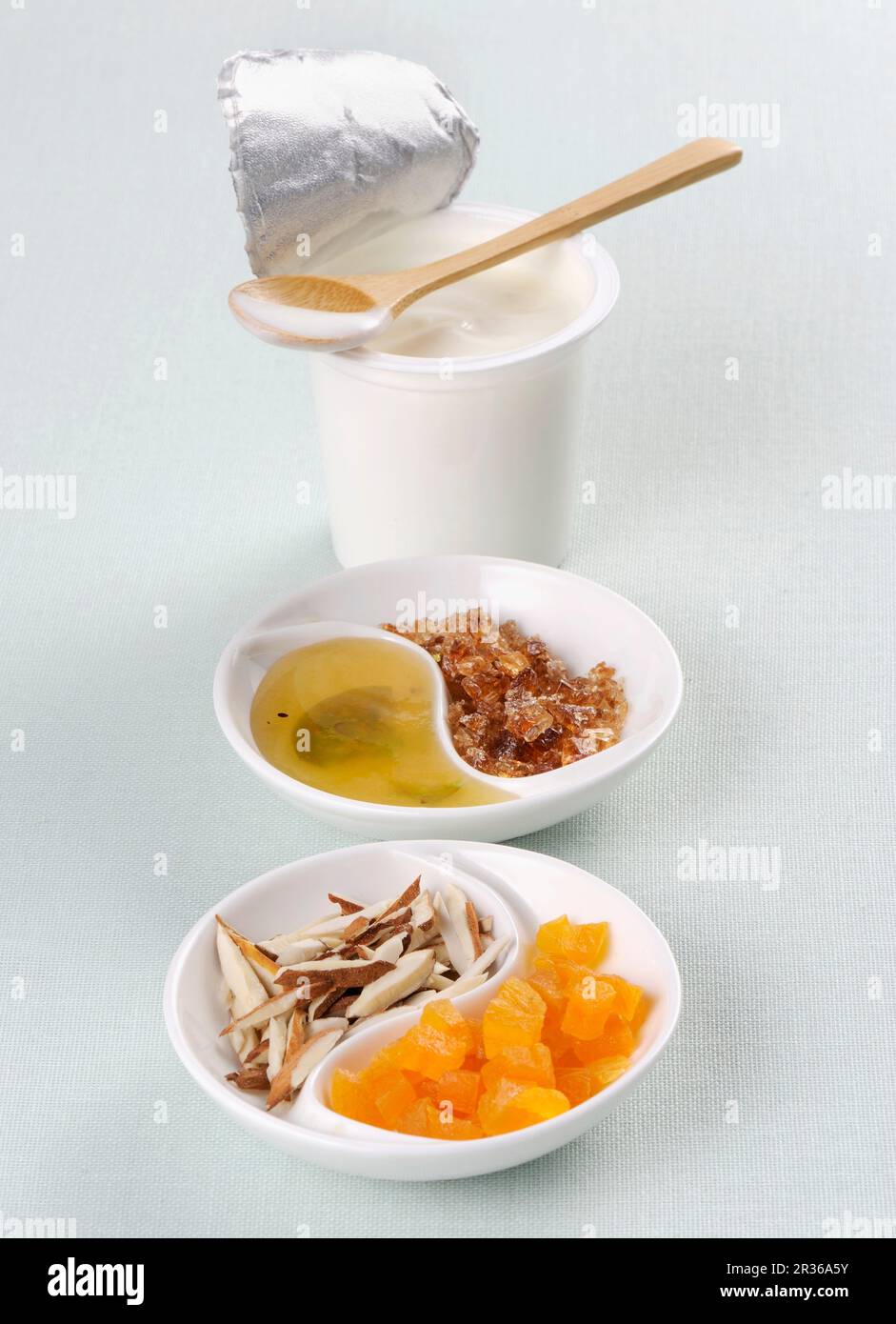 Yoghurt, honey, rock sugar, coconut and candied fruit Stock Photo Alamy