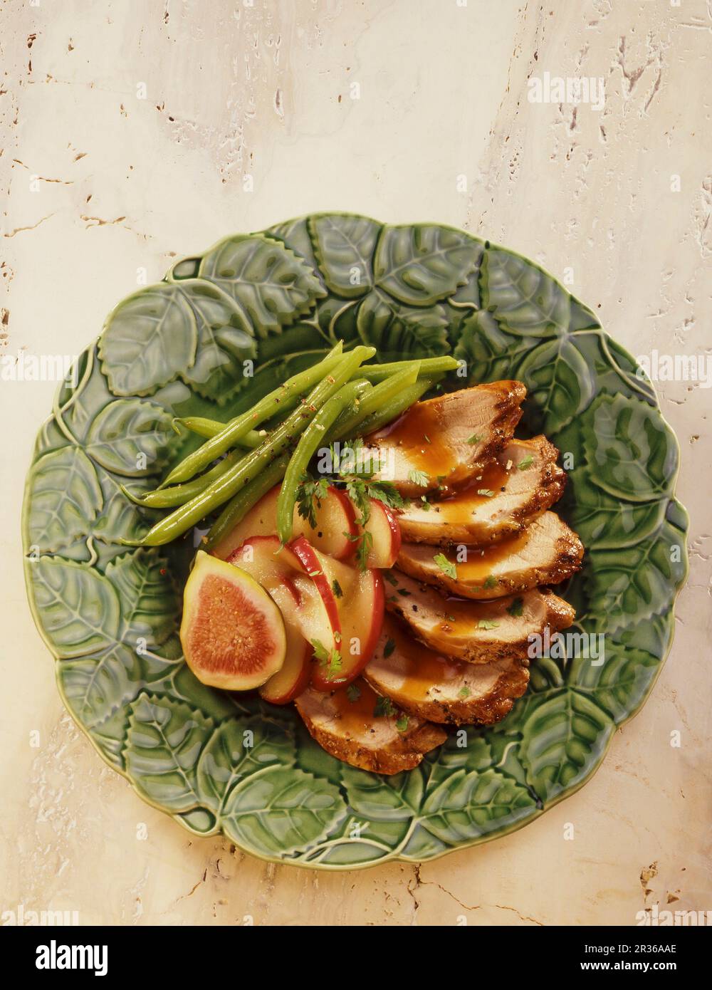 Pork fillet with green beans, apples and figs Stock Photo Alamy