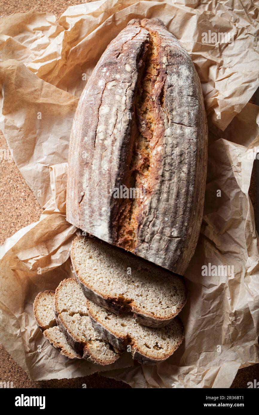 A sliced loaf of bread on a piece of paper Stock Photo