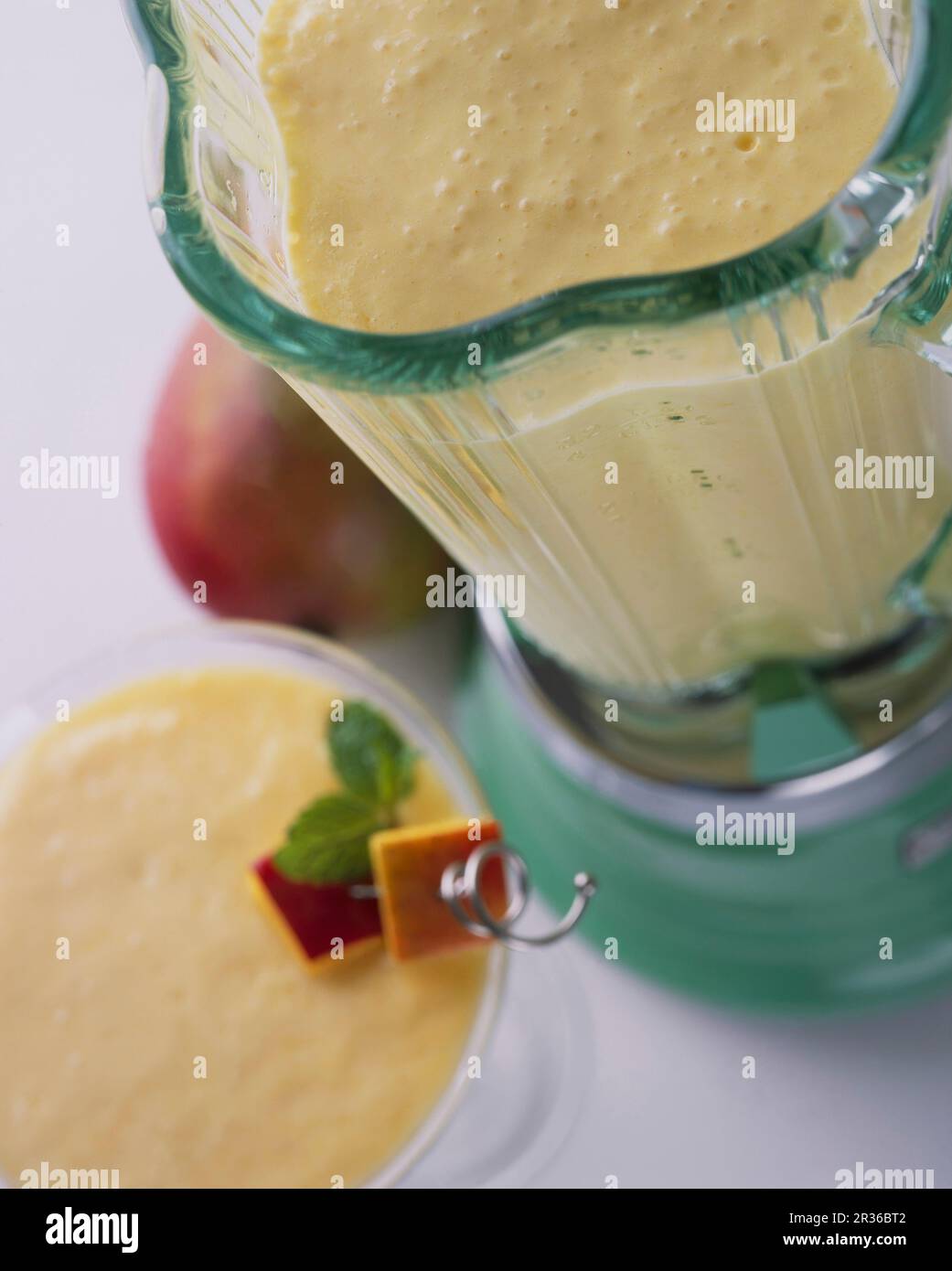 A mango smoothie in a blender Stock Photo