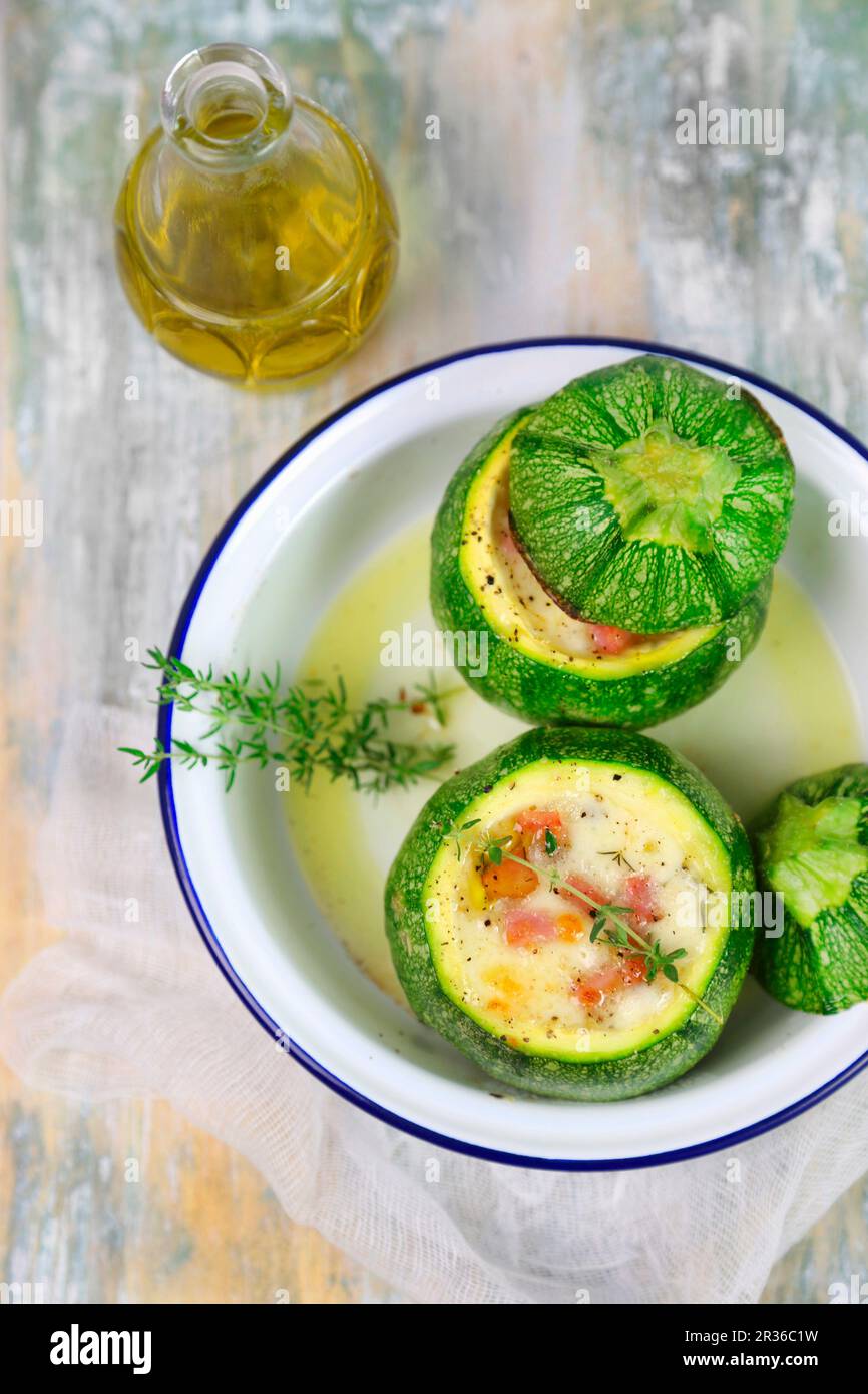 Round courgettes filled with ham and cheese Stock Photo