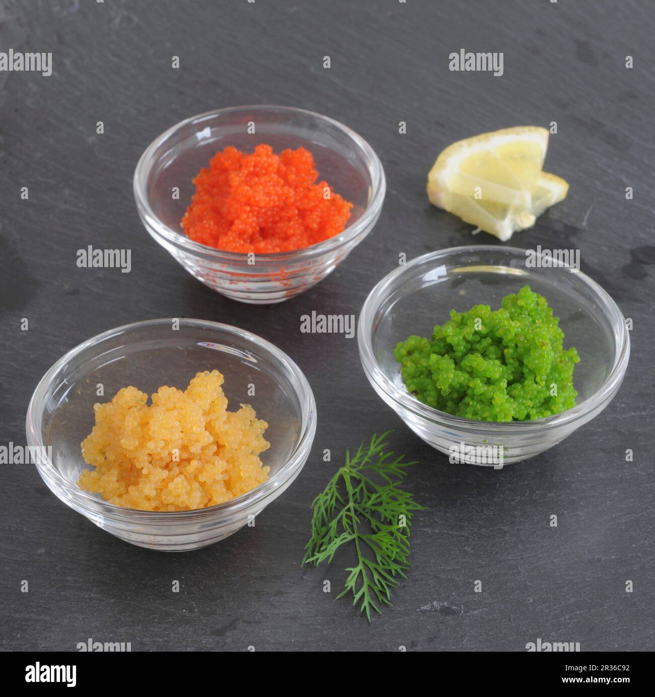 Flying fish tobiko roe in glass bowls Stock Photo