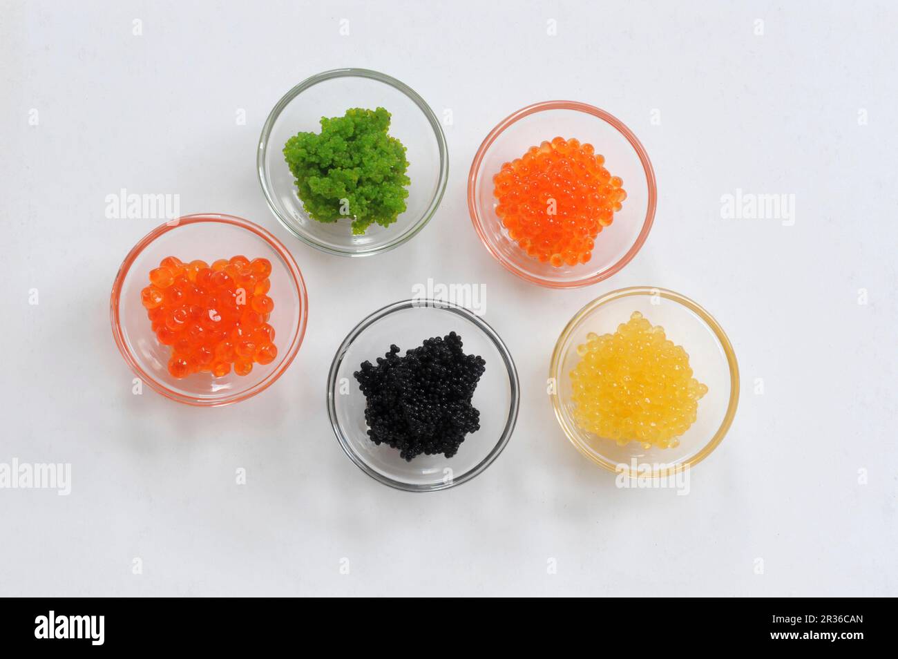 Various types of caviar in glass bowls Stock Photo