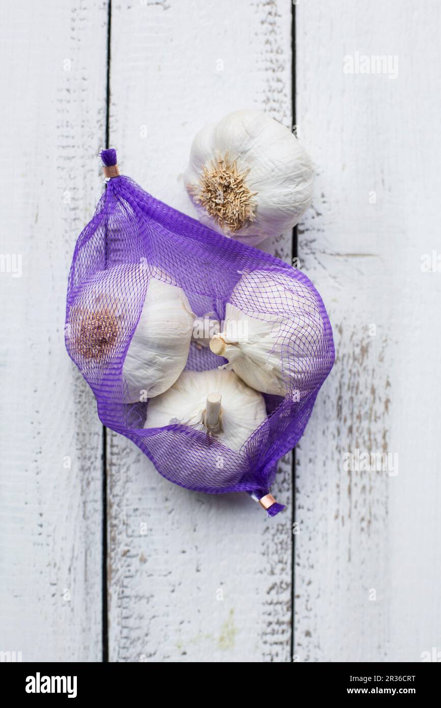 Garlic in net hi-res stock photography and images - Alamy