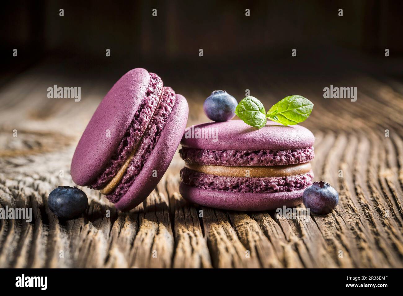 Blueberry macaroons on a wooden table Stock Photo