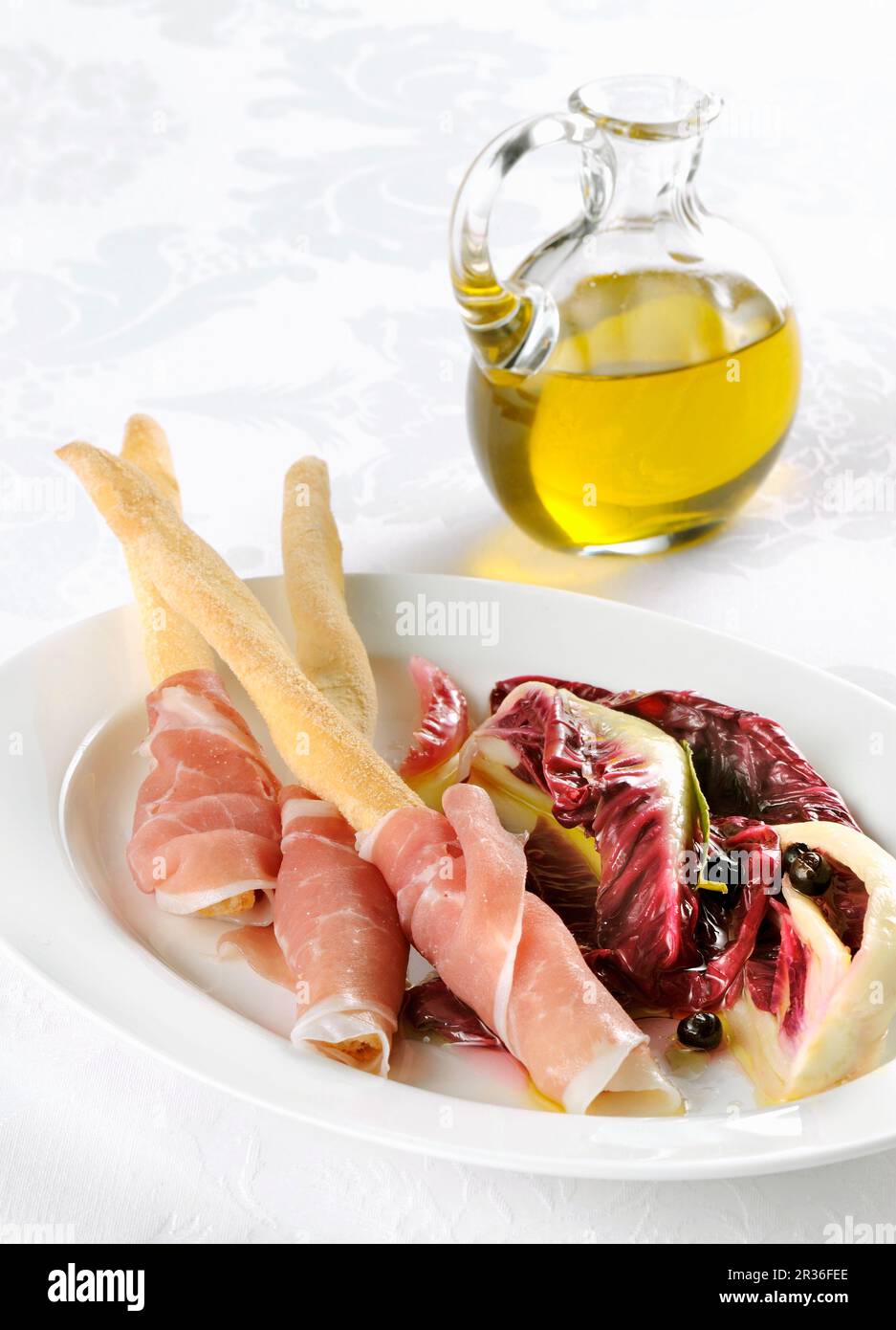 Breadsticks with San Daniele ham and a radicchio salad Stock Photo