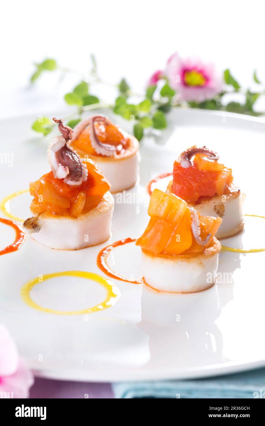Scallops with salmon and baby octopus Stock Photo