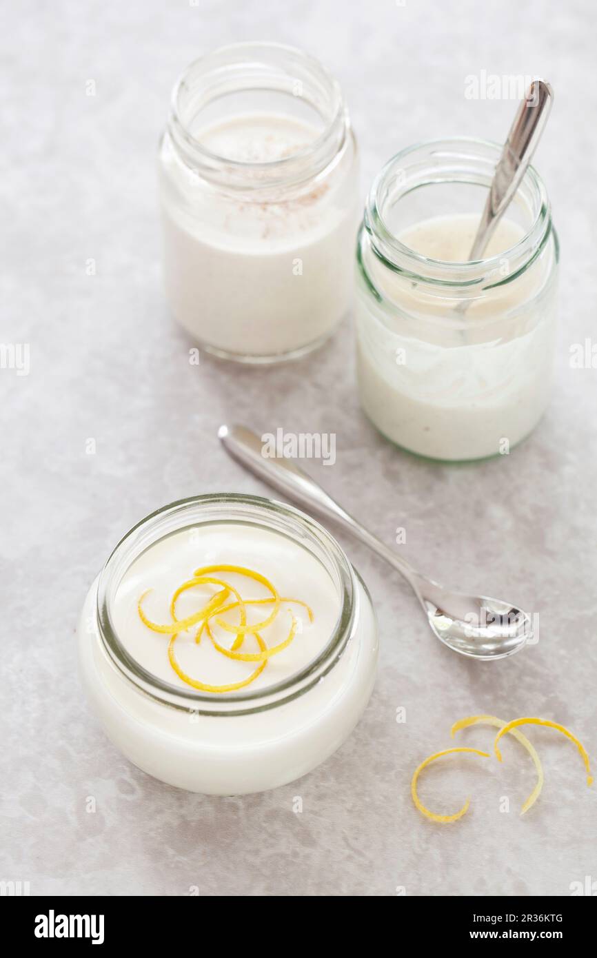 Assorted flavoured yoghurts in glass jars Stock Photo Alamy
