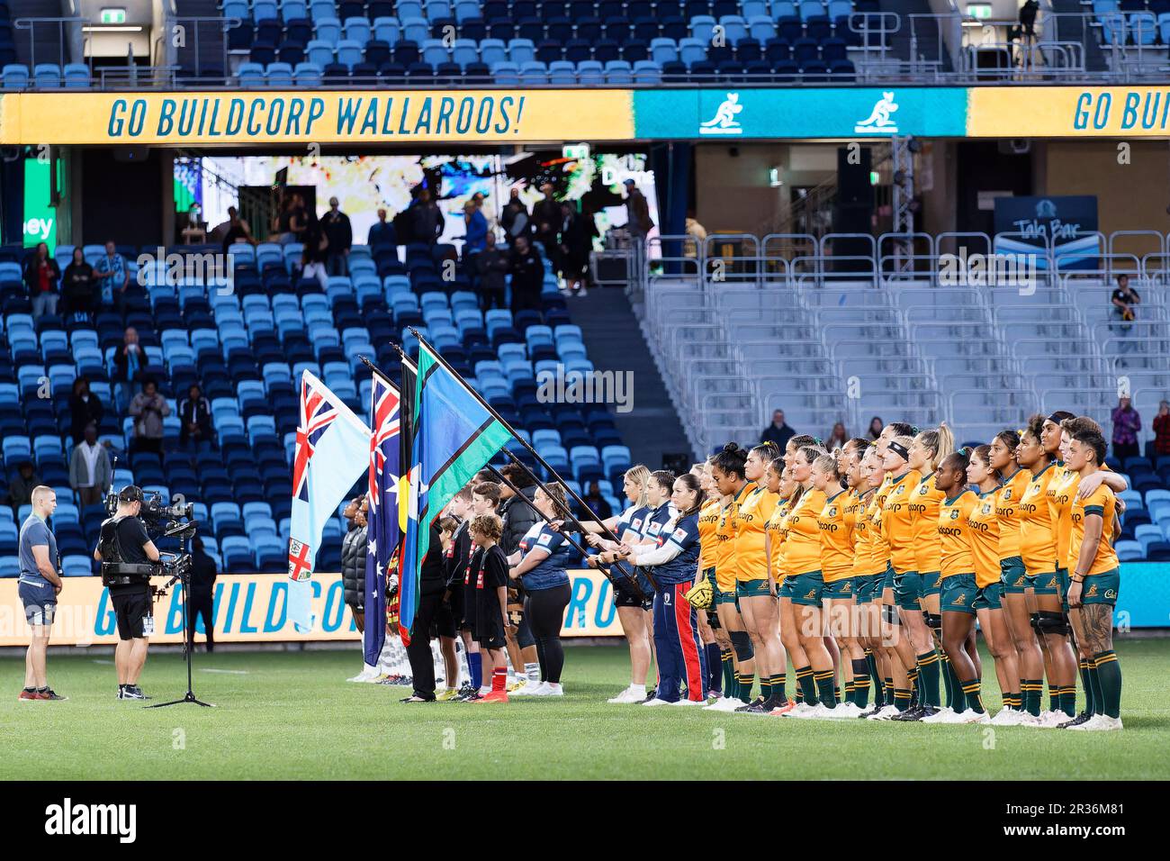 The Australian Wallaroos line up for the national anthems before the Rugby Women's International match between Australia and the Fiji at Allianz Stadi Stock Photo
