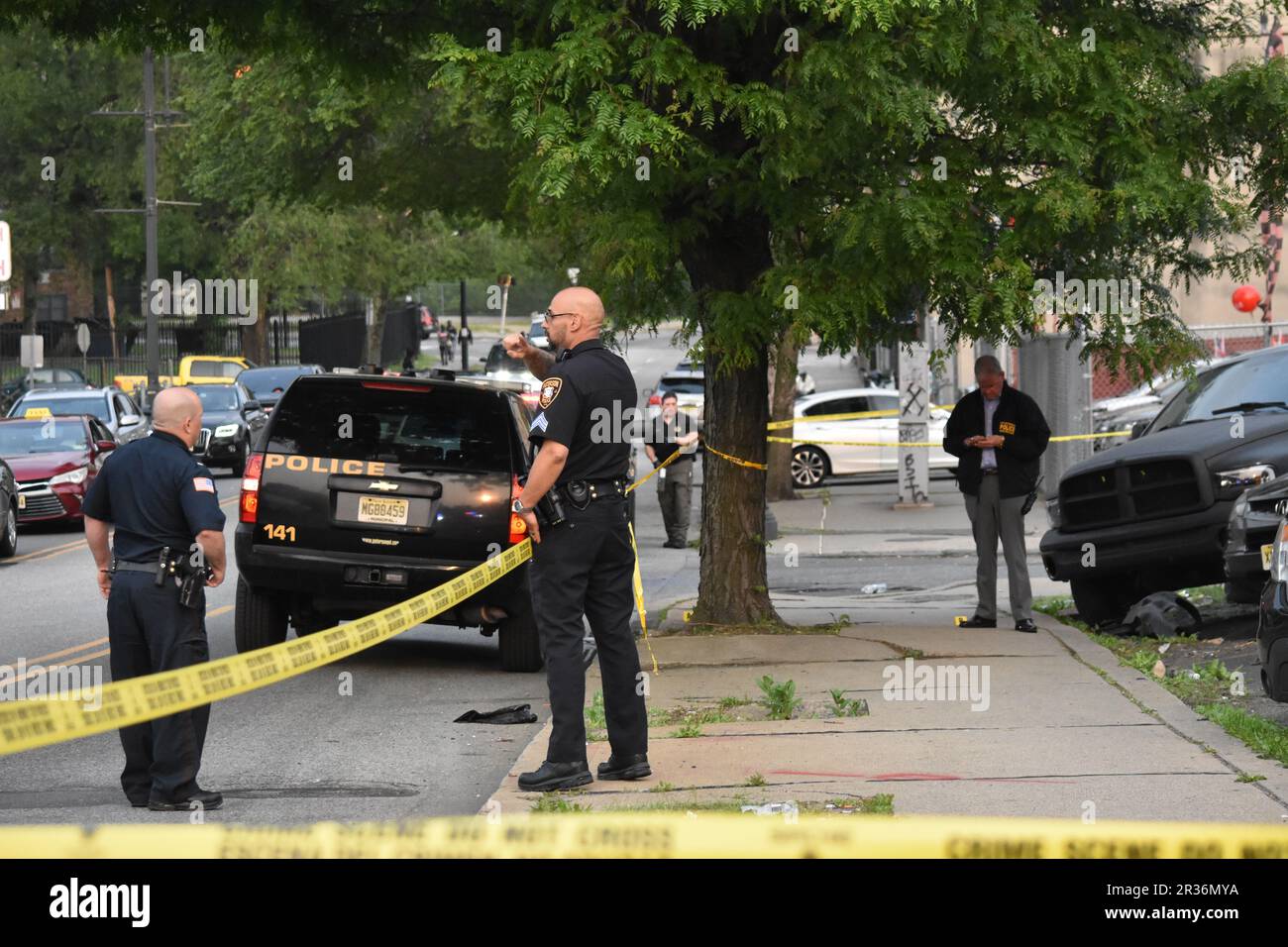Paterson, United States. 22nd May, 2023. Police officers at the crime