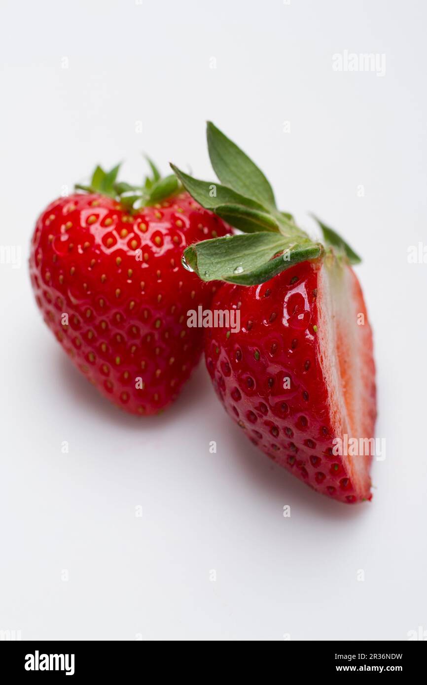 One strawberry and half cut out hi-res stock photography and images - Alamy