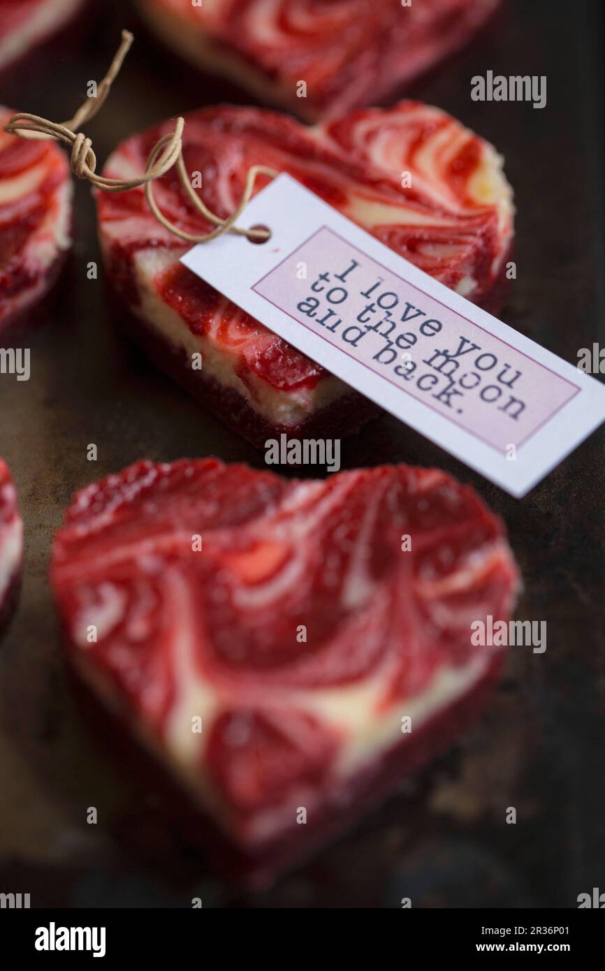 Marbled heartshaped mini cheesecakes with a gift tag for Valentine's