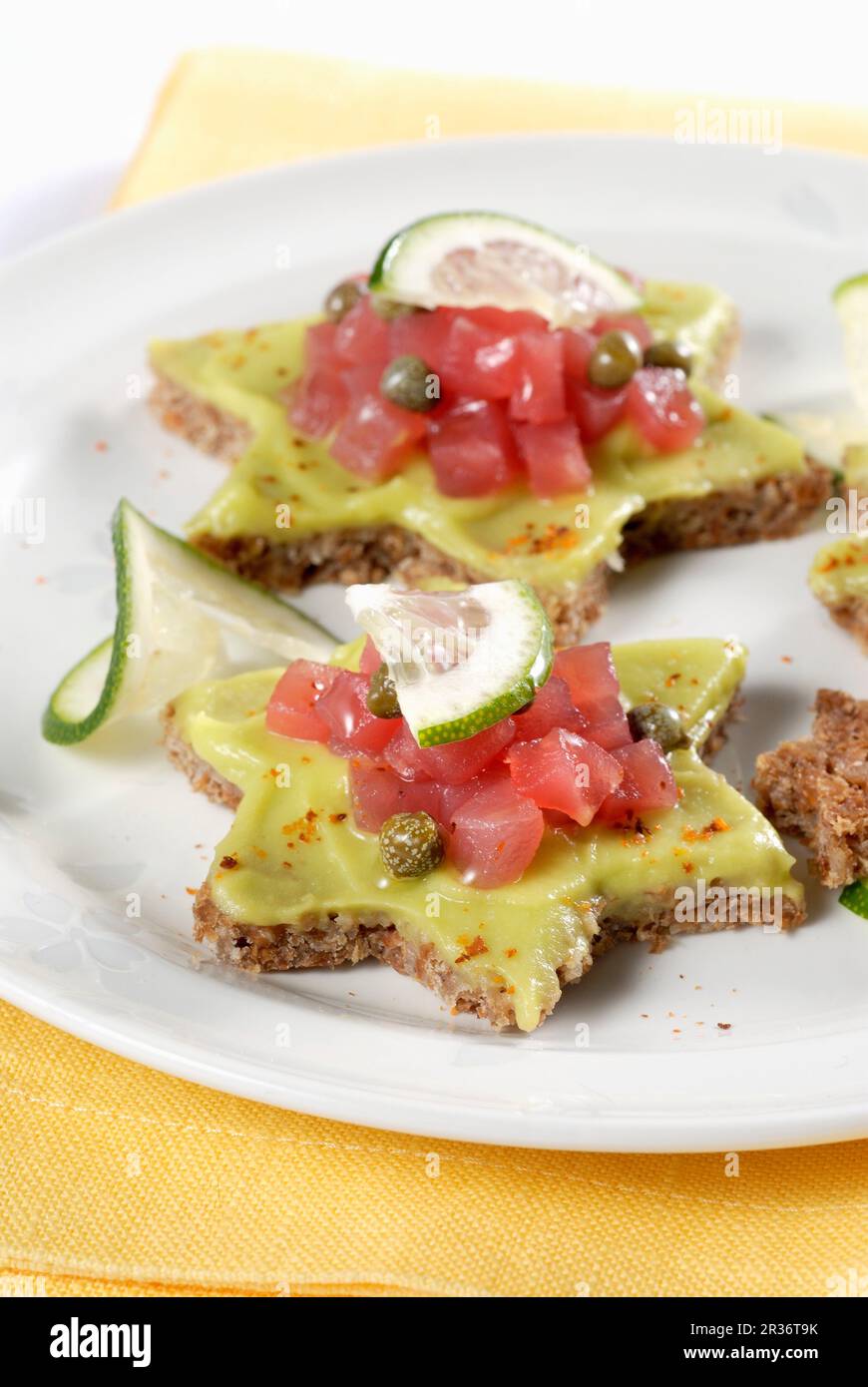 Wholemeal stars with avocado cream and tuna tartare Stock Photo Alamy