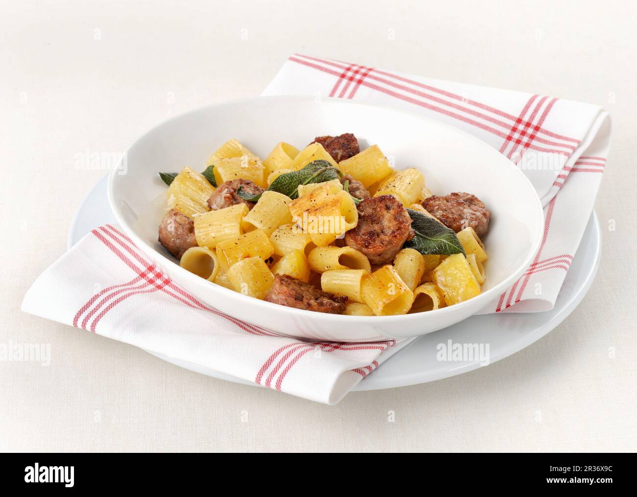 Mezze maniche pasta with sausage and sage Stock Photo