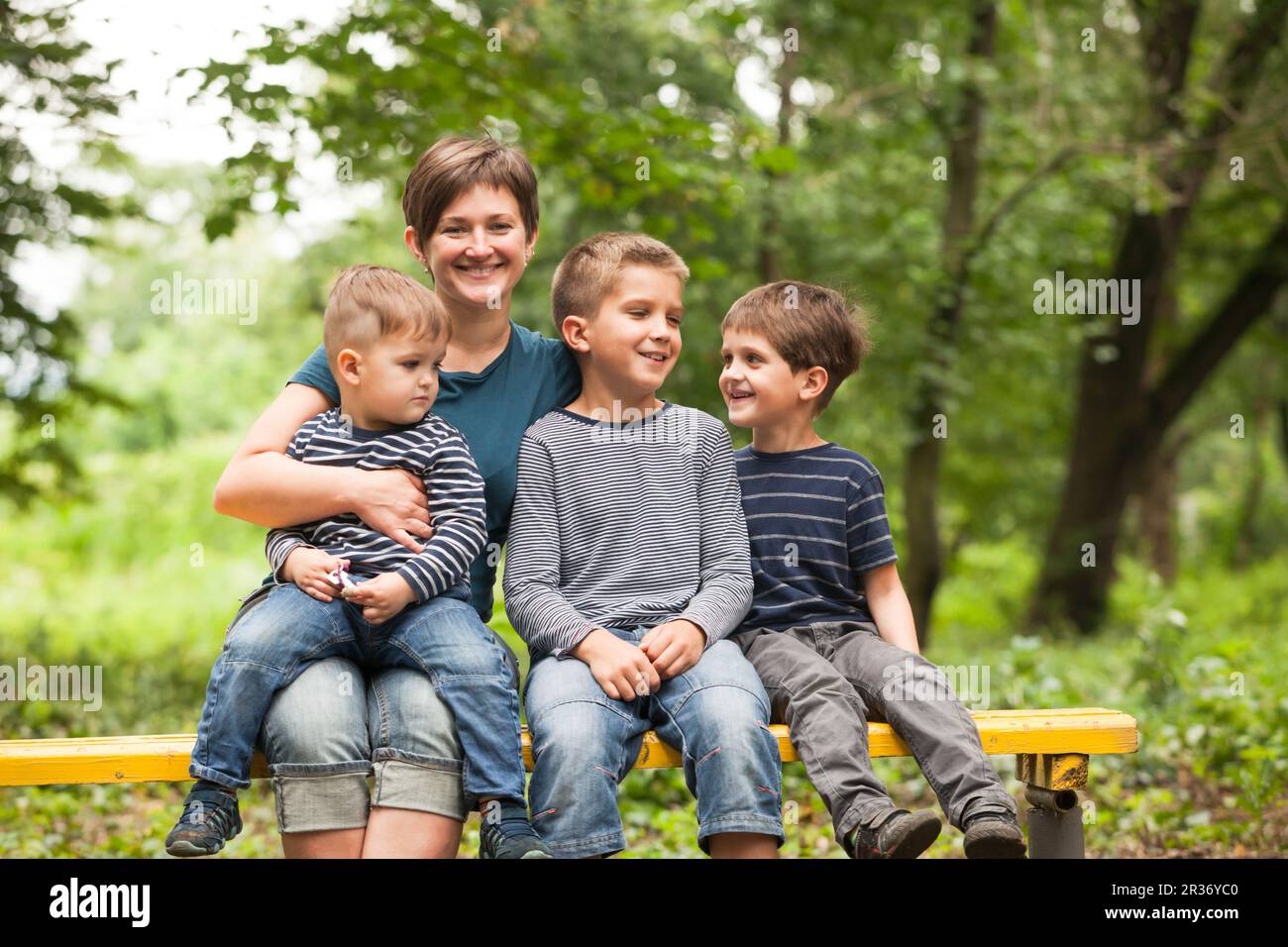 Mother with sons outdoors Stock Photo