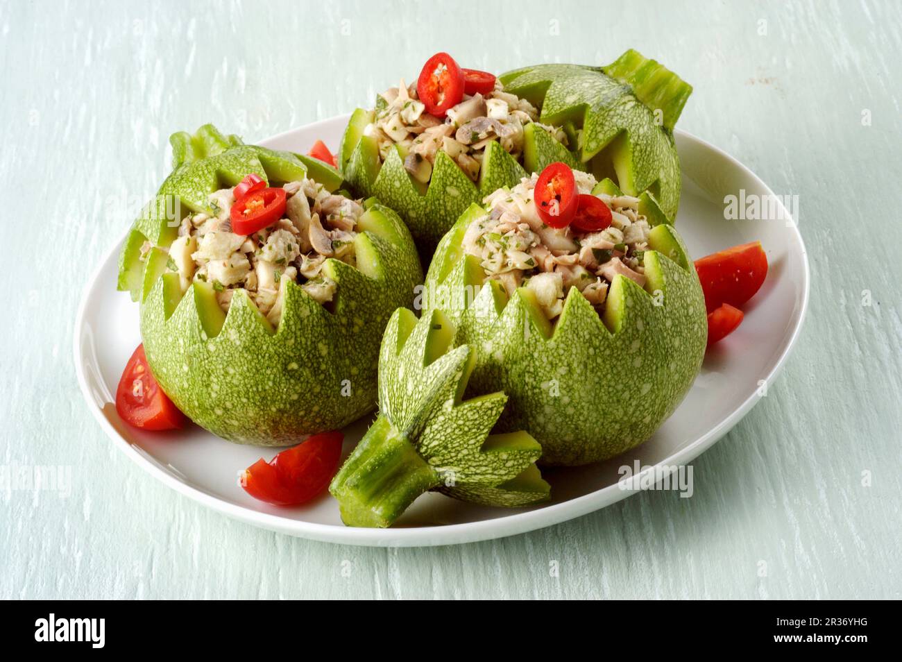 Round courgettes stuffed with mushrooms Stock Photo