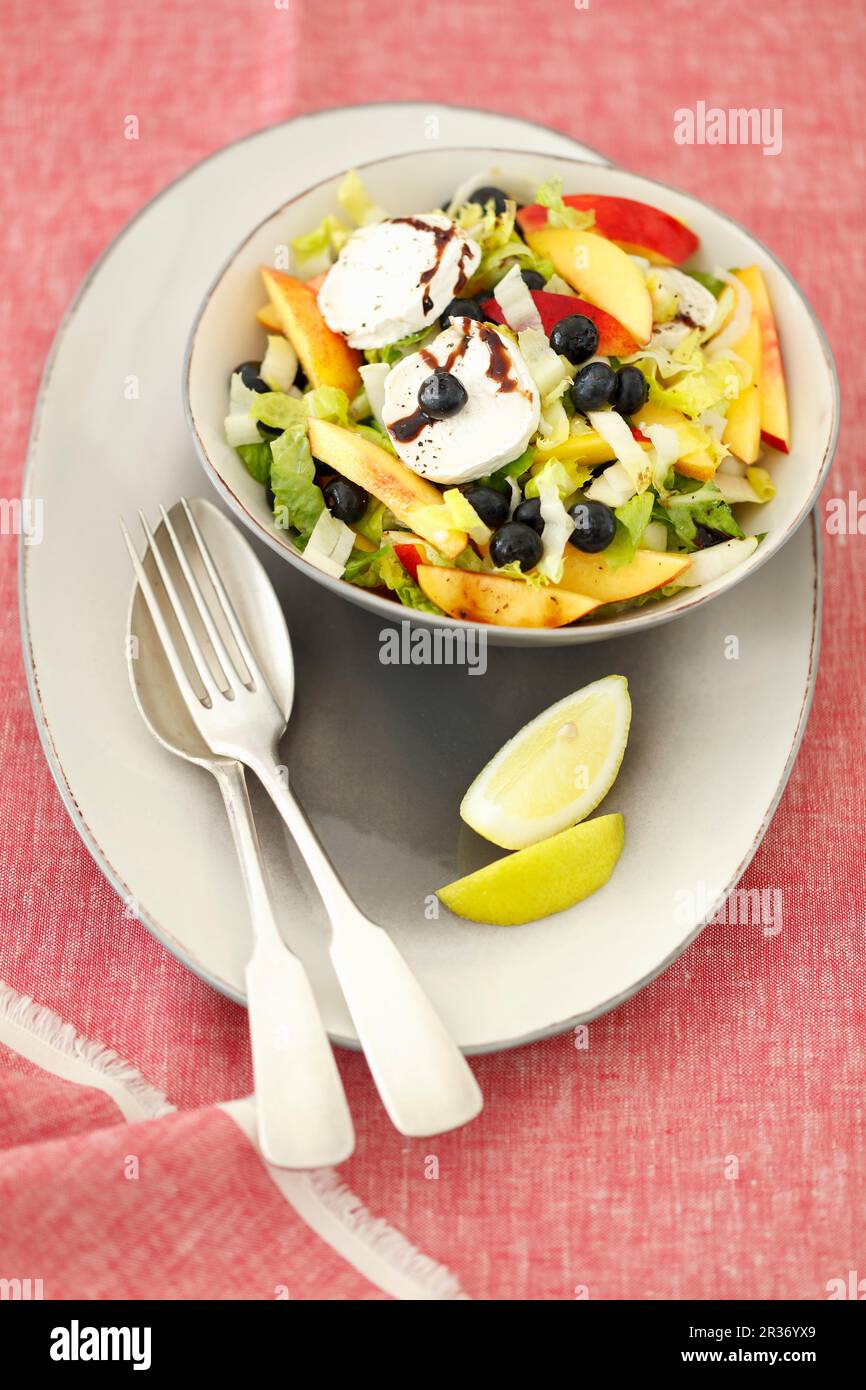 Chicory and cos lettuce salad with nectarines, blueberries and goats' cheese Stock Photo Alamy