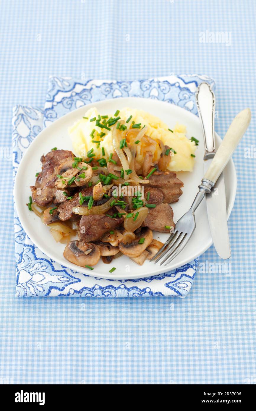 Chicken liver with onion, mushrooms, potato purée Stock Photo Alamy