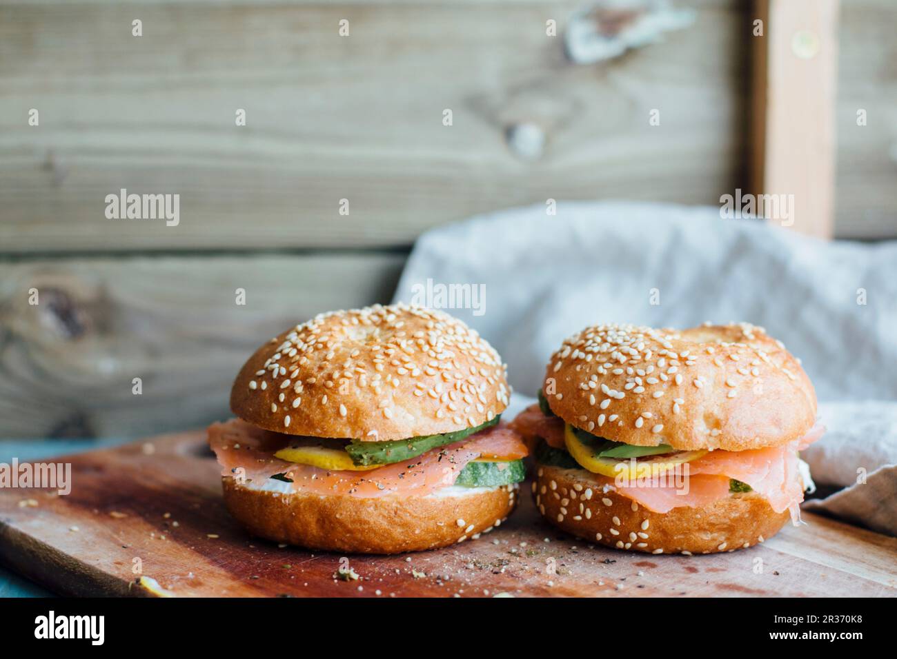 Sesame seed buns with smoked salmon, lemon and avocado Stock Photo Alamy