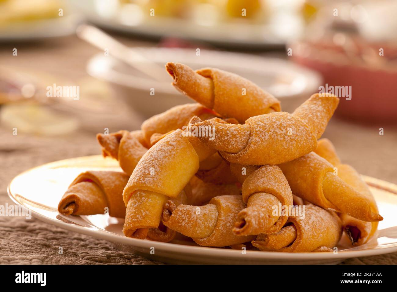 Rolled cookies with rose jam Stock Photo - Alamy