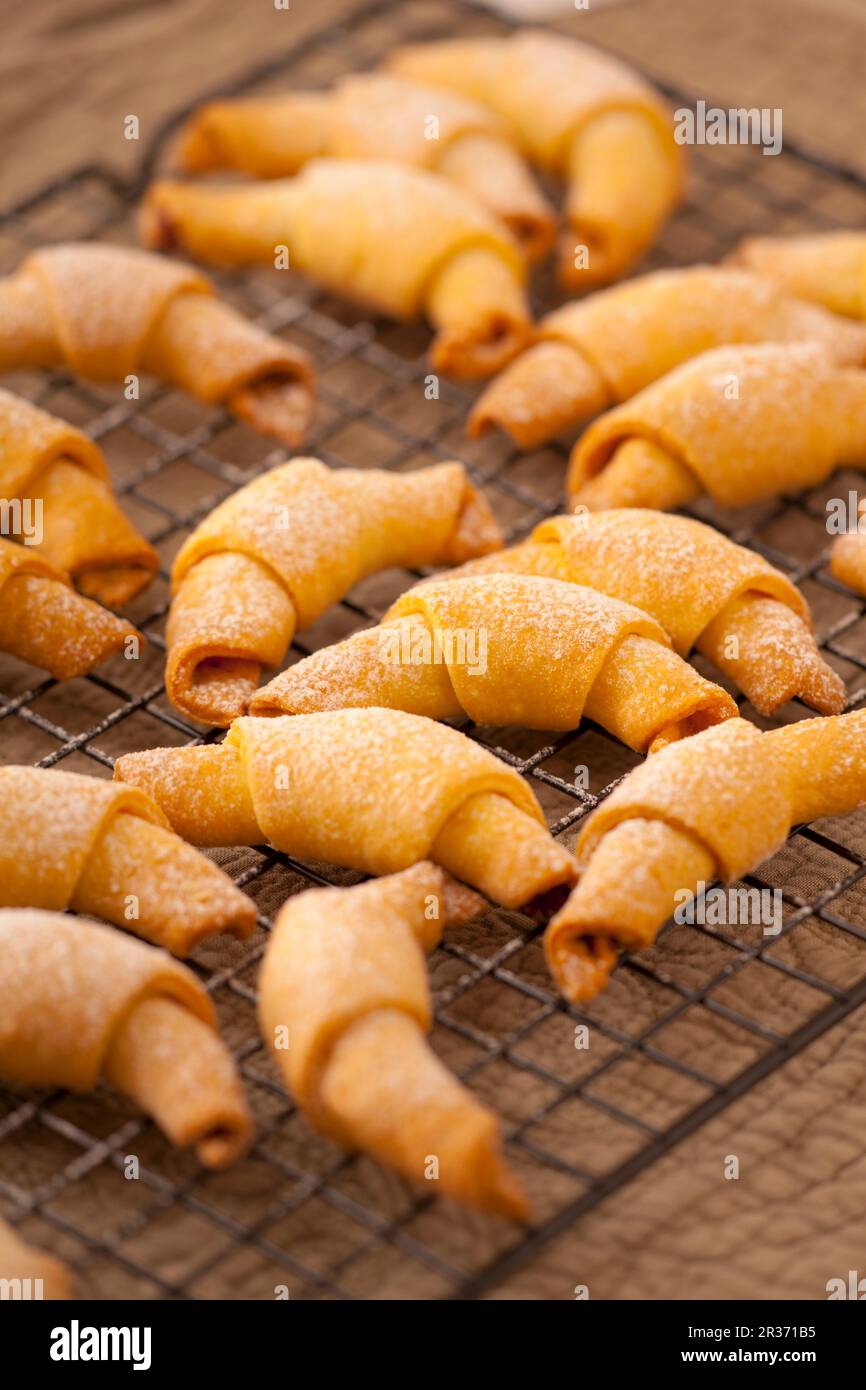Rolled cookies with rose jam Stock Photo - Alamy