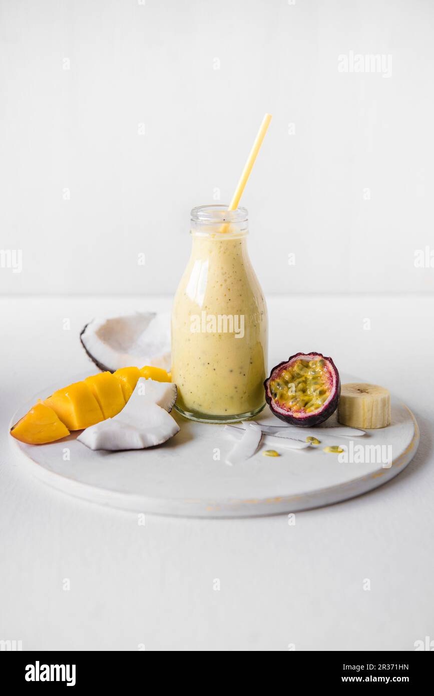 A coconut milk, mango, banana and passion fruit smoothie Stock Photo