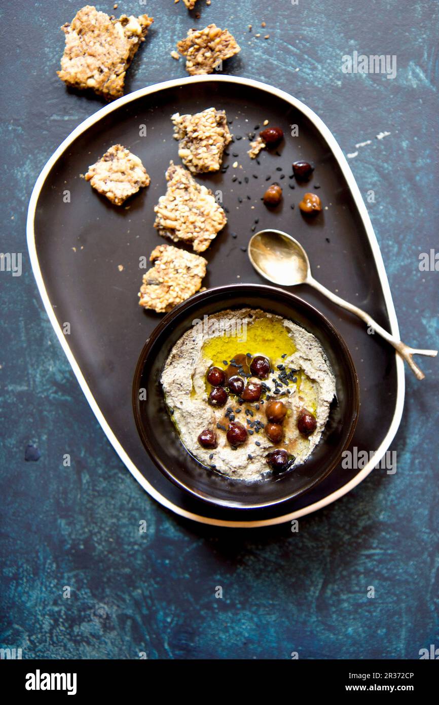 Hummus with black chickpeas and sesame seeds Stock Photo Alamy