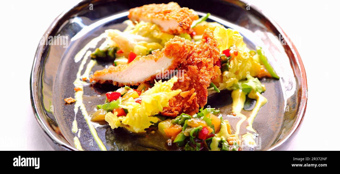 Wiener Schnitzel (breaded veal escalope) with salad Stock Photo