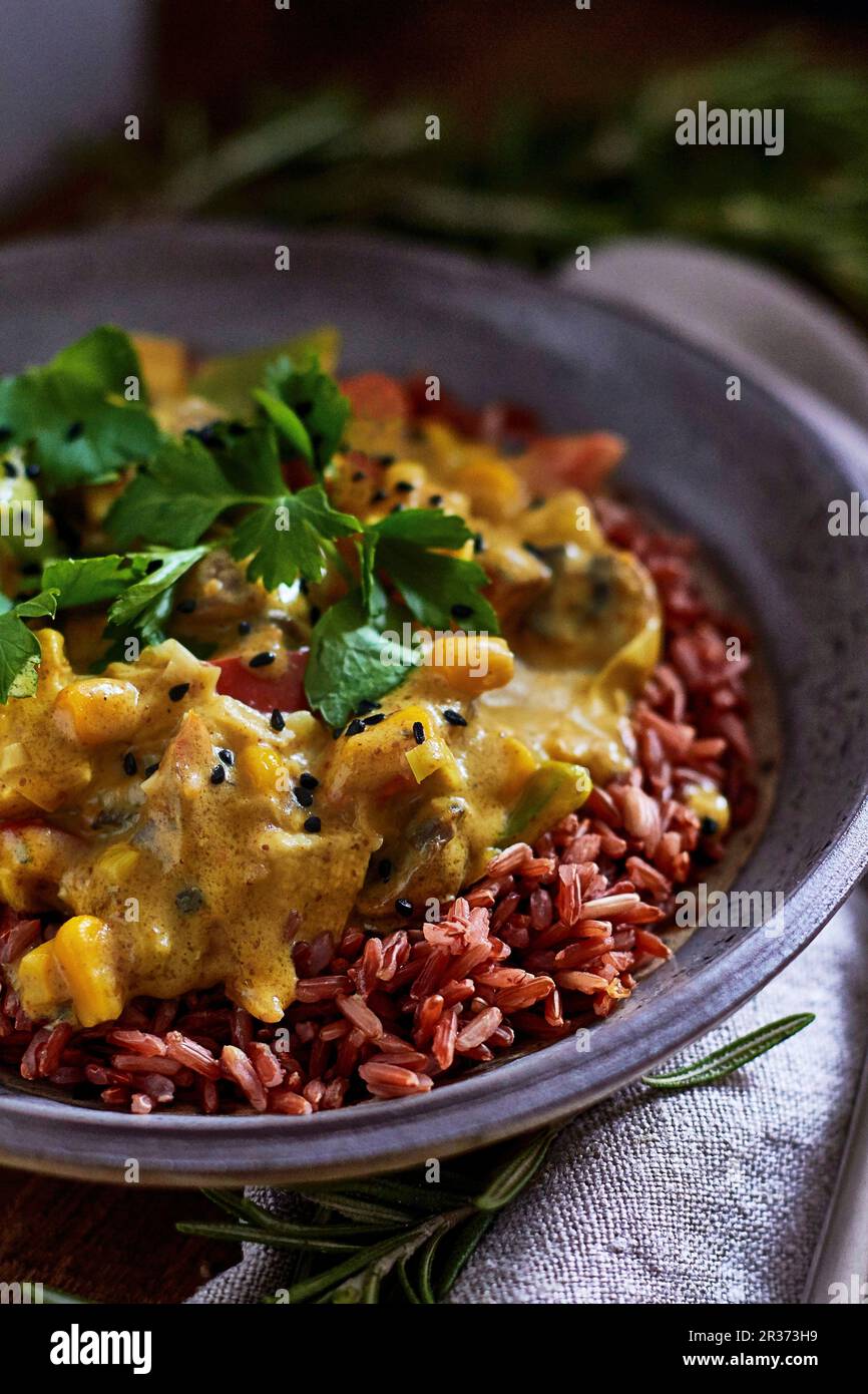 Vegan tofu curry with red rice Stock Photo Alamy