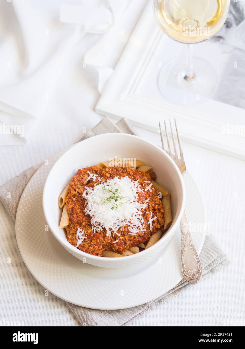 Soya chunks bolognese sauce with whole grain penne pasta Stock Photo