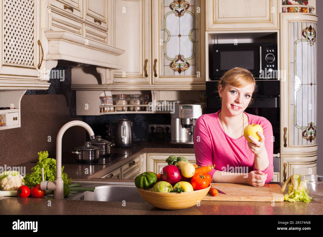One woman alone in kitchen hi-res stock photography and images - Alamy