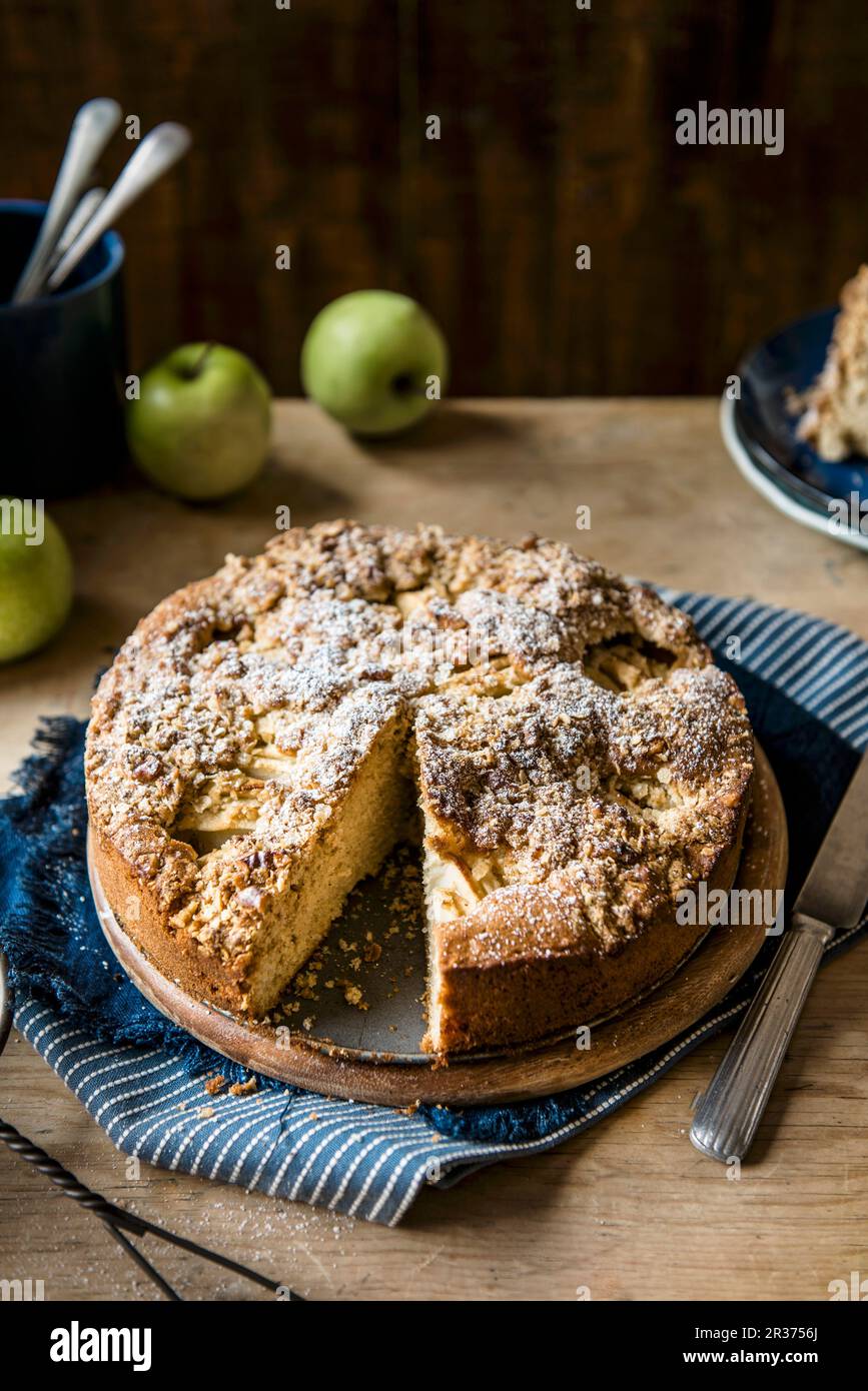 Apple cake with walnuts and oats crumble topping, slive removed Stock Photo Alamy