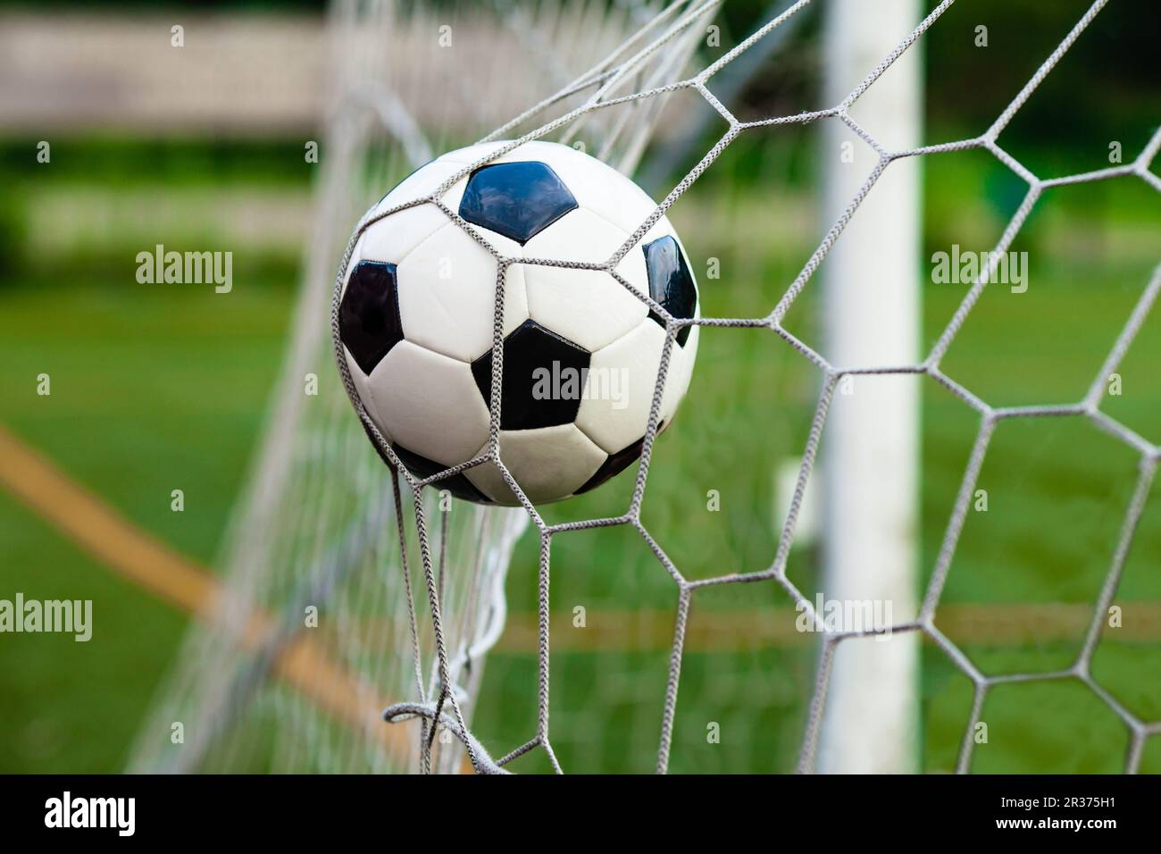 Soccer ball in goal Stock Photo