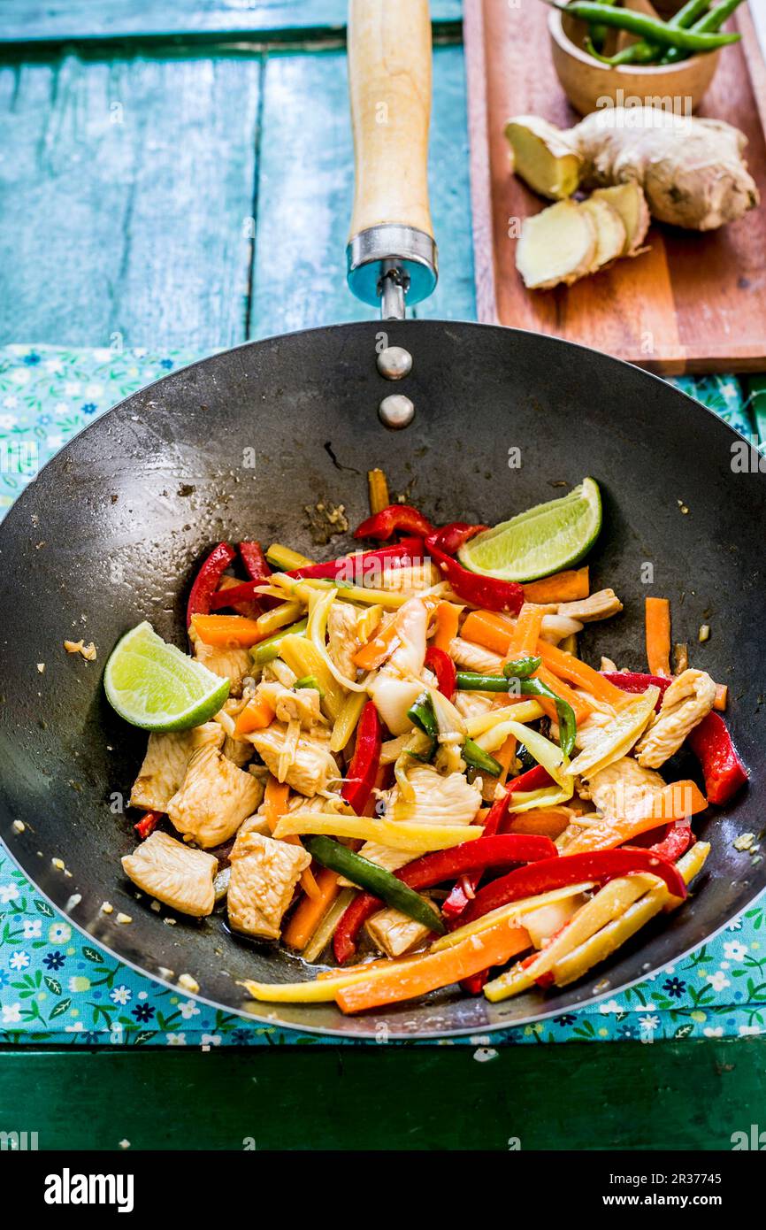 Chicken with ginger and vegetables in a wok (Asia Stock Photo - Alamy