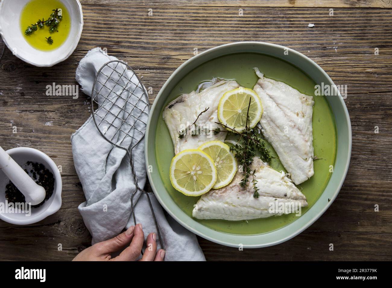Fillet of plaice with lemon, olive oil and thyme Stock Photo Alamy
